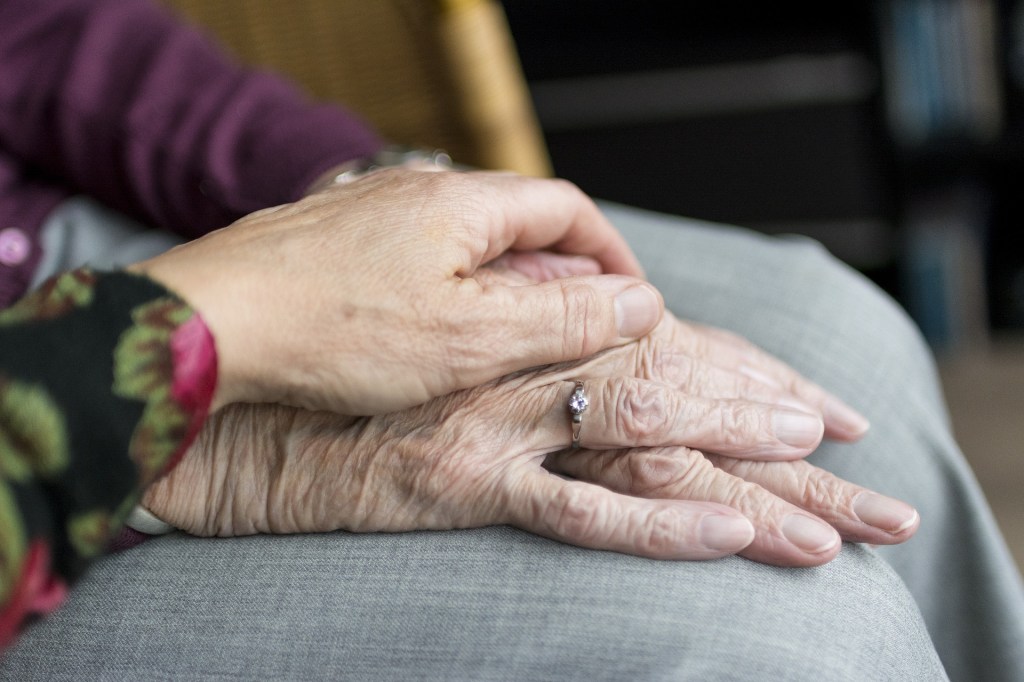Grandmother and granddaughter holding hands